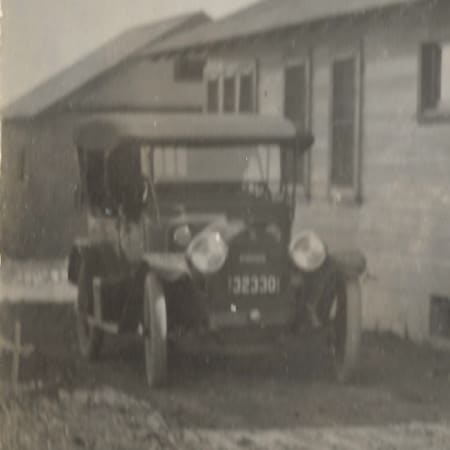 The Bates Page "36" automobile parked next to their Paularino House